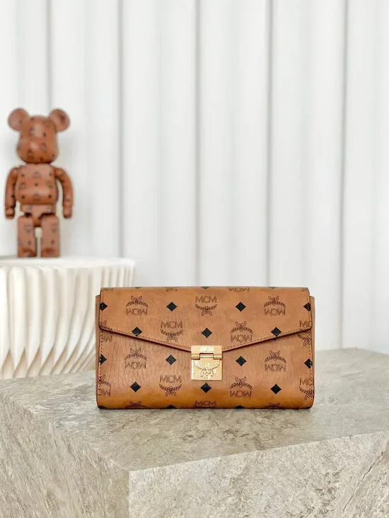 MCM Tan Monogram Clutch with Gold Accent - Picture 1 of 9